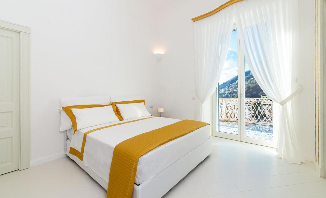 Amore Rentals - Palazzo Della Storia Amalfi Bagian luar foto