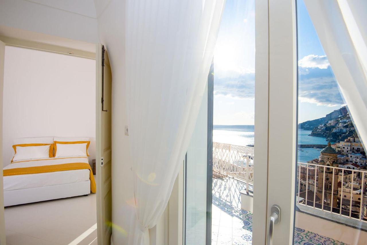 Amore Rentals - Palazzo Della Storia Amalfi Bagian luar foto