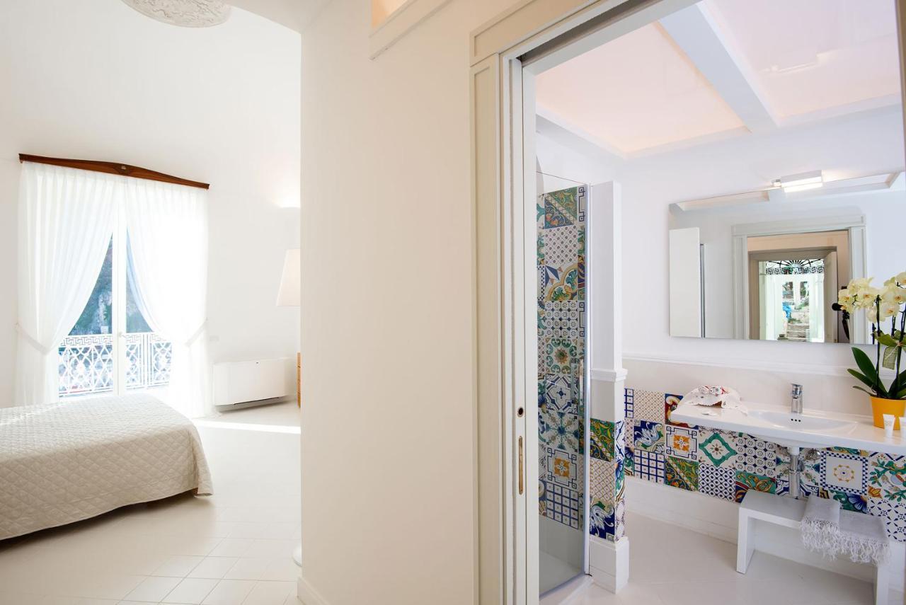 Amore Rentals - Palazzo Della Storia Amalfi Bagian luar foto
